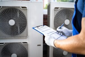 hvac contractor holding clipboard