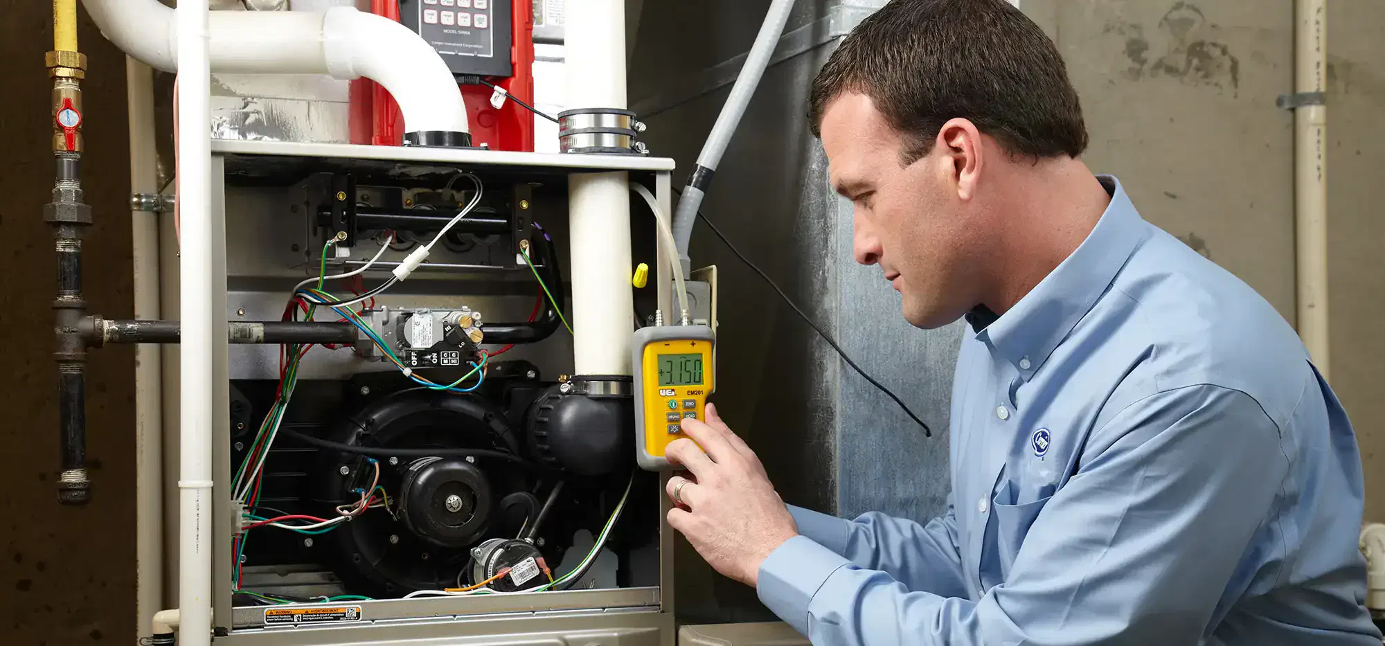 Technician Performing Furnace Repair in Phoenix Home