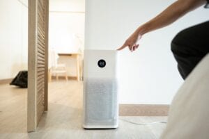Press,start,button,on,air,purifier,turning,on,an,air