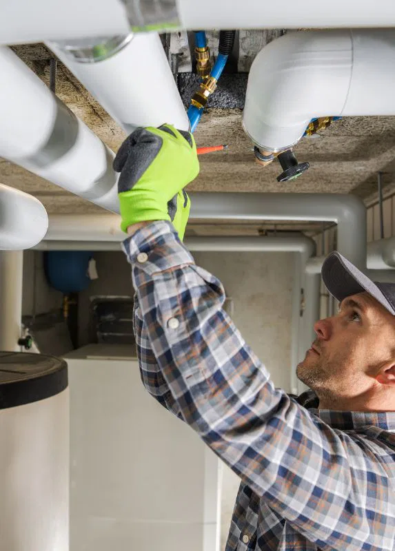 Plumber Repairing Pipe